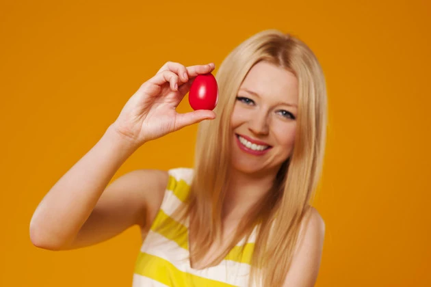 Woman with red easter egg